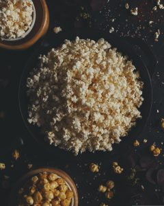 Bowls of popcorn and caramel corn.