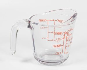 A clear glass liquid measuring cup with a 2-cup capacity.