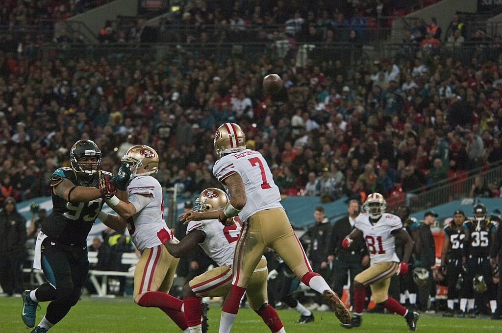 Two football teams clash.