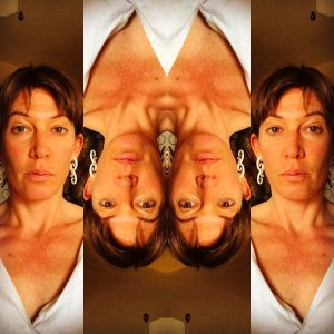 Images of author, Diana Daly; 4 spliced images with the two outer images right-side up, and the two inner images, upside-down. Dr. Daly is shown identically in each image with bangs, brown hair pulled back, and a white blouse.