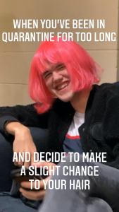 A meme depicting a person laughing while seated, with a hot pink colored wig on their head and the words "when you've been in quarantine for too long and decide to make a slight change to your hair".