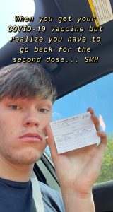 Meme of a young man in a car holding a vaccine card looking at the camera with the words "When you get your COVID-19 vaccine but realize you have to go back for the second dose... SMH".