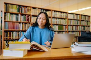 College student studying at a desk.