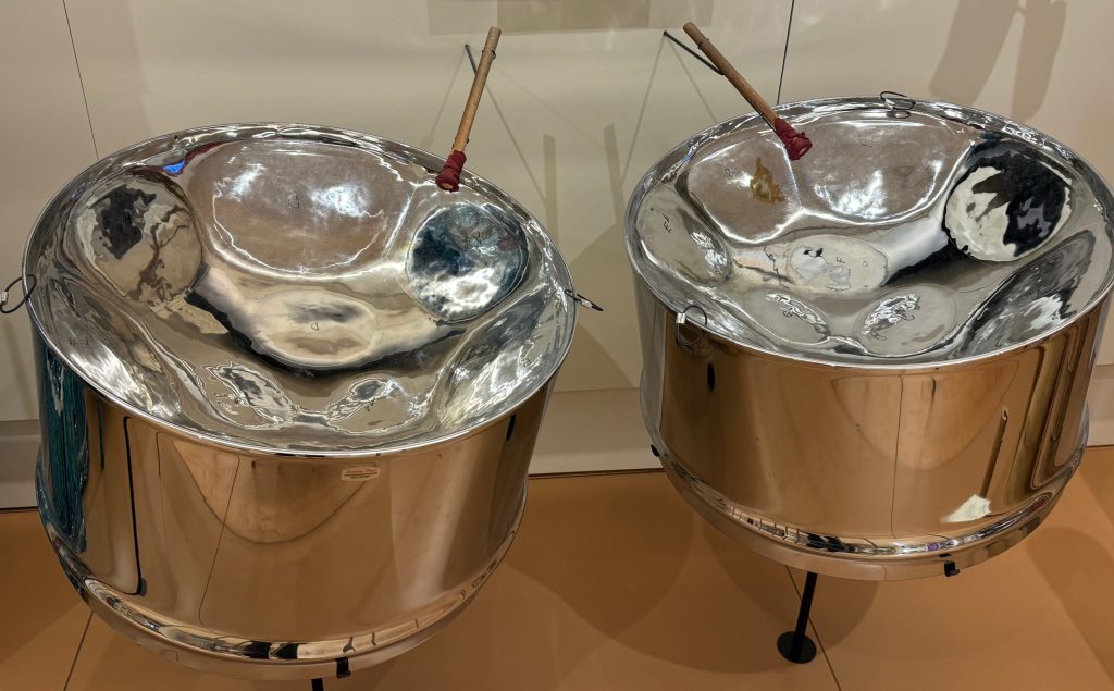 two metal drums with different sized indentations on the top that are struck by mallets to make a different tones.